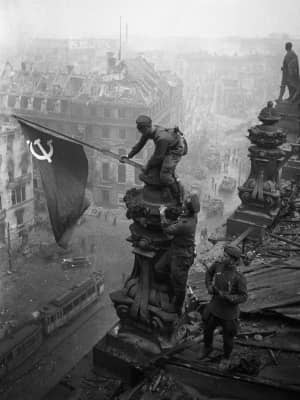Raising a Flag over the Reichstag - Photograph by Yevgeny Khaldei