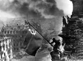Raising a Flag over the Reichstag - Photograph by Yevgeny Khaldei