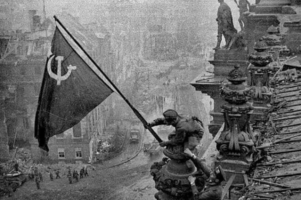 Raising a Flag over the Reichstag - Photograph by Yevgeny Khaldei