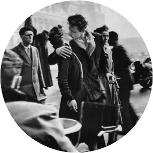 Kiss by the Hôtel de Ville - Photograph by Robert Doisneau